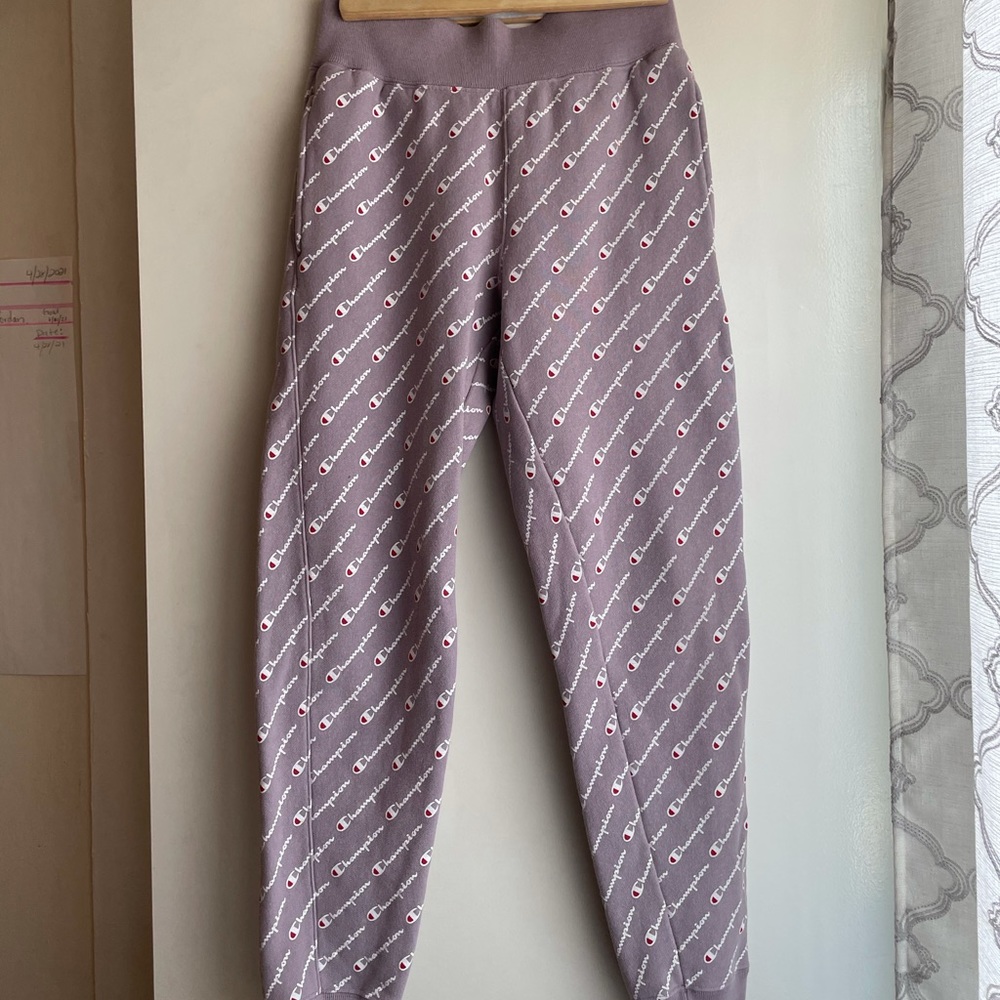 Purple Champion sweats with logo all over.